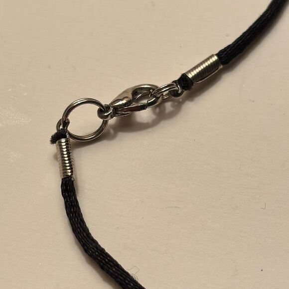 Black crafted glass floral pendant with reverse etched design on black cord - Picture 3 of 7